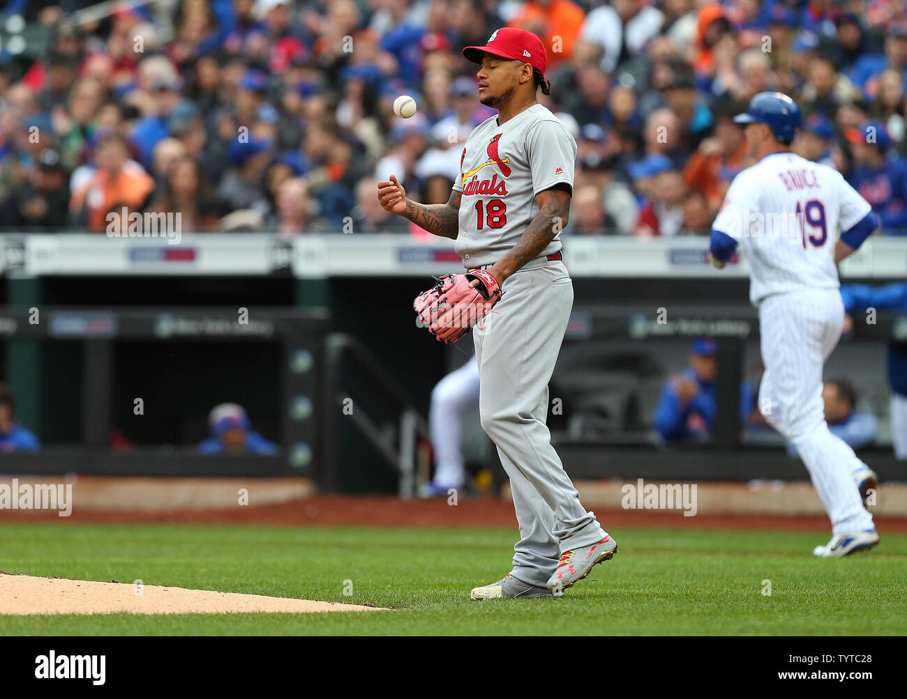 St. Louis Cardinals pitcher Carlos Martinez #18 reacts after walking  New York Mets Jay Bruce #19 to load the bases in the second inning on Opening Day at Citi Field in New York City on March 29, 2018.   Photo by Rich Schultz/UPI Stock Photo