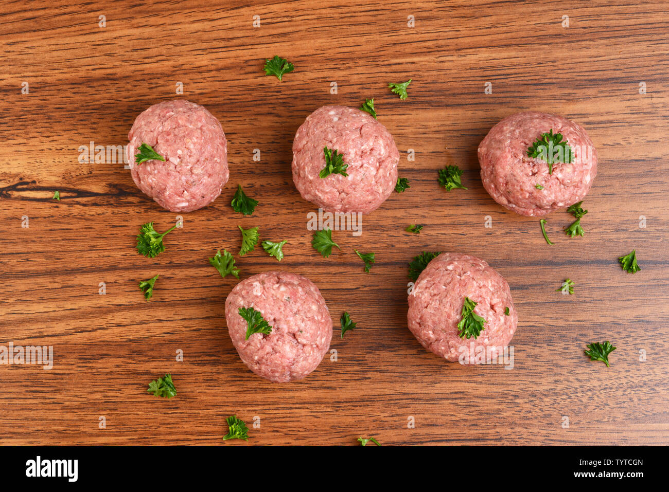 top view raw meatballs with parsley Stock Photo