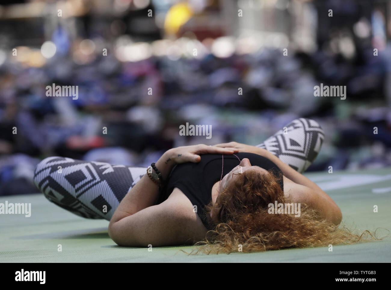 People Participate In Yoga Classes In Times Square To Celebrate The Summer Solstice On The First 