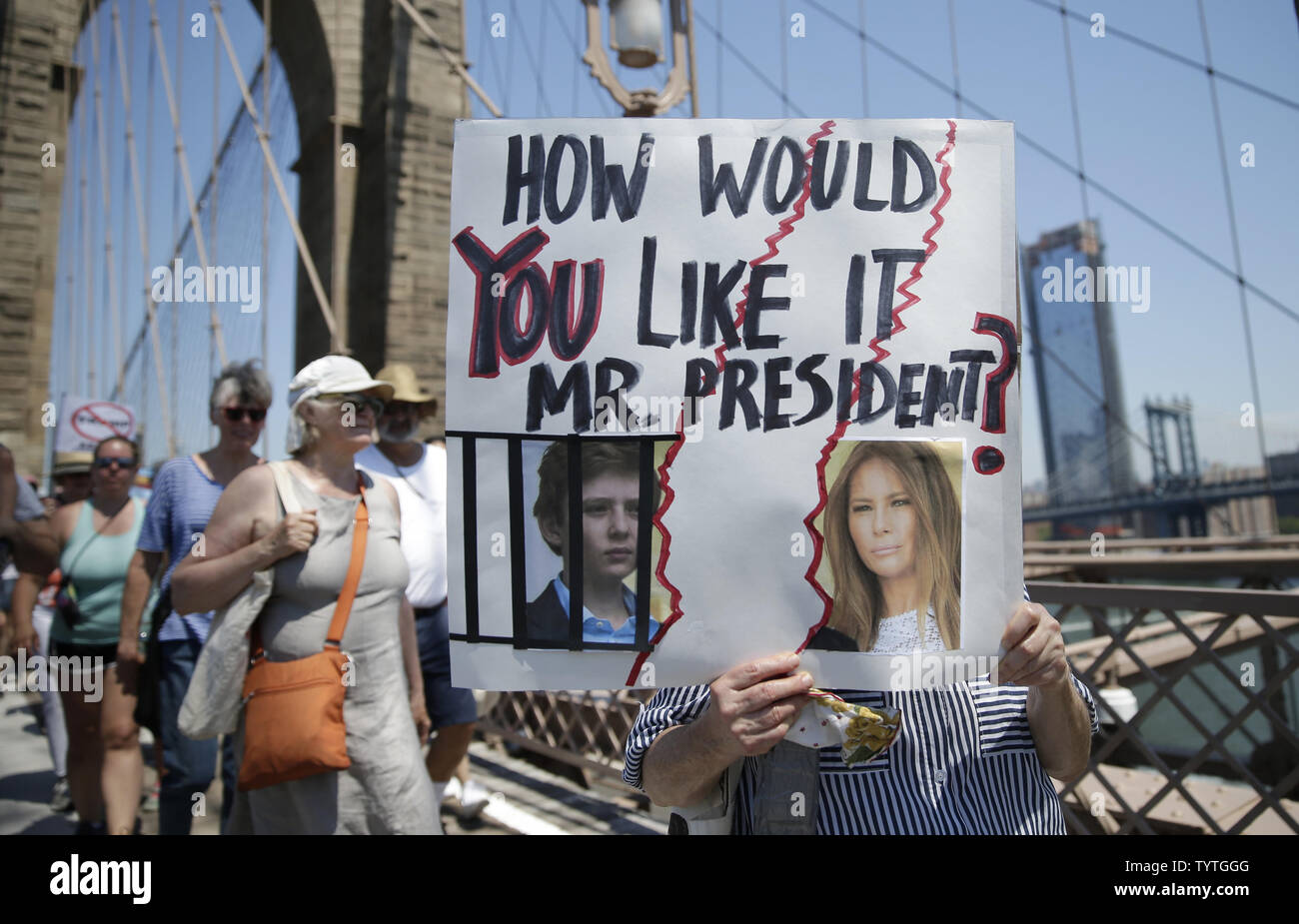 Protesters hold up signs at the End Family Separation NYC Rally and March in New York City on June 30, 2018. Demonstrators gathered in cities across the United States on Saturday to protest the White House's 'zero tolerance' immigration policy that has prompted the separations and detentions of migrant families.      Photo by John Angelillo/UPI Stock Photo