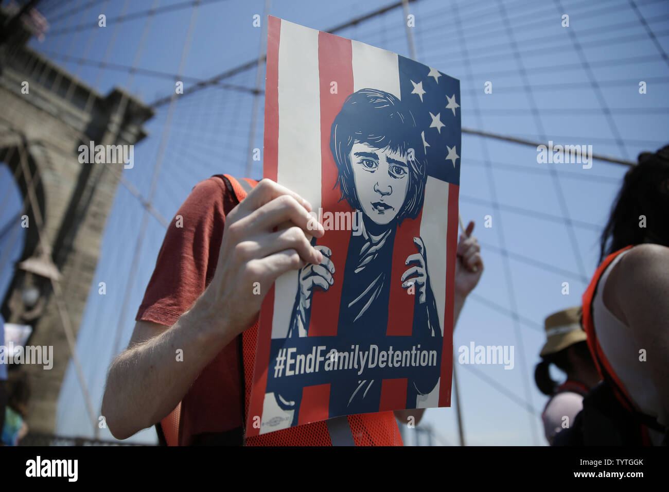 Protesters hold up signs at the End Family Separation NYC Rally and March in New York City on June 30, 2018. Demonstrators gathered in cities across the United States on Saturday to protest the White House's 'zero tolerance' immigration policy that has prompted the separations and detentions of migrant families.      Photo by John Angelillo/UPI Stock Photo