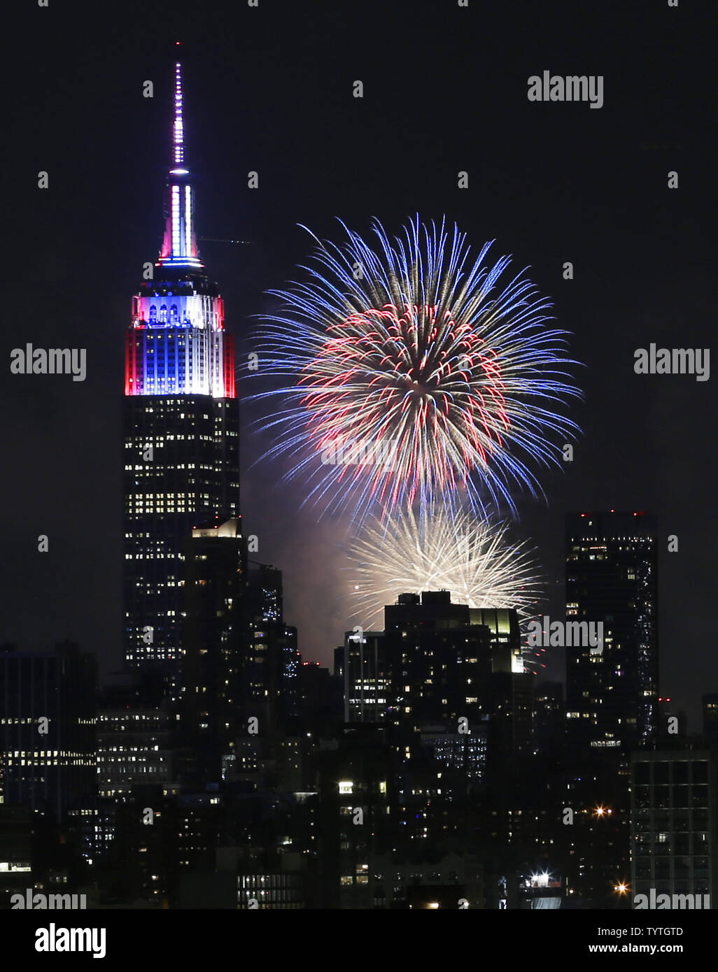 Fireworks explode over the Empire State Building and the Manhattan