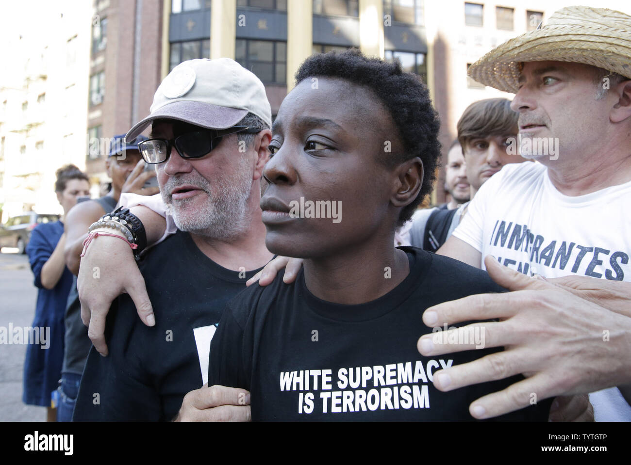 Statue Of Liberty climber and Rise and Resist protester Therese Okoumou exits Court with supporters in New York City on July 5, 2018 in New York City. The woman who partially climbed up the Statue of Liberty on July 4th Independence Day and prompted authorities to evacuate Liberty Island was released without bail, and if convicted would face up to six months behind bars.    Photo by John Angelillo/UPI Stock Photo