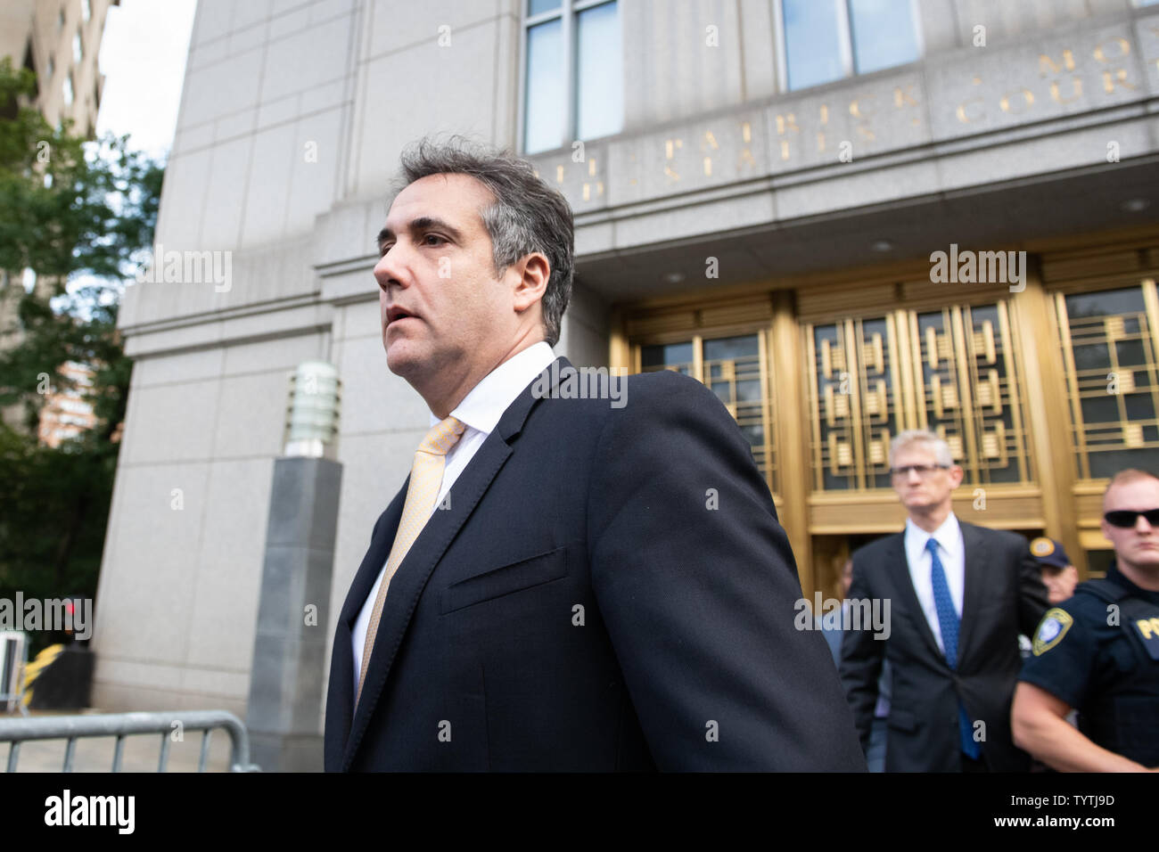 Attorney Michael Cohen walks out of Federal Courthouse after pleading
