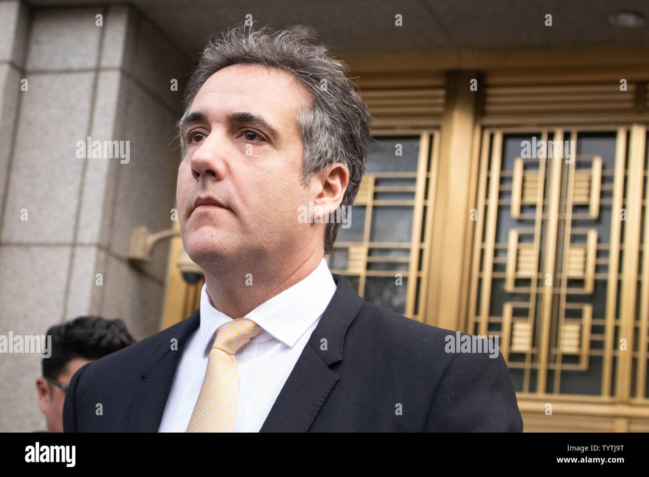Attorney Michael Cohen walks out of Federal Courthouse after pleading