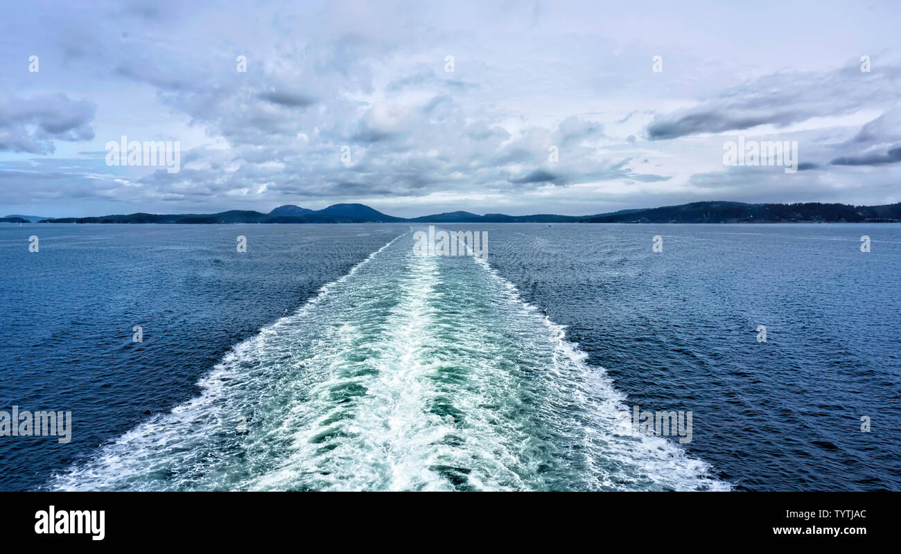 Water wake behind speed boat in Canada will make for great background graphic. Stock Photo