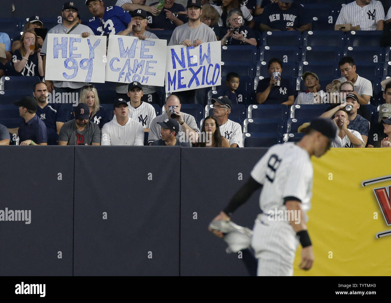 Fans hold up signs for New York Yankees Aaron Judge before the