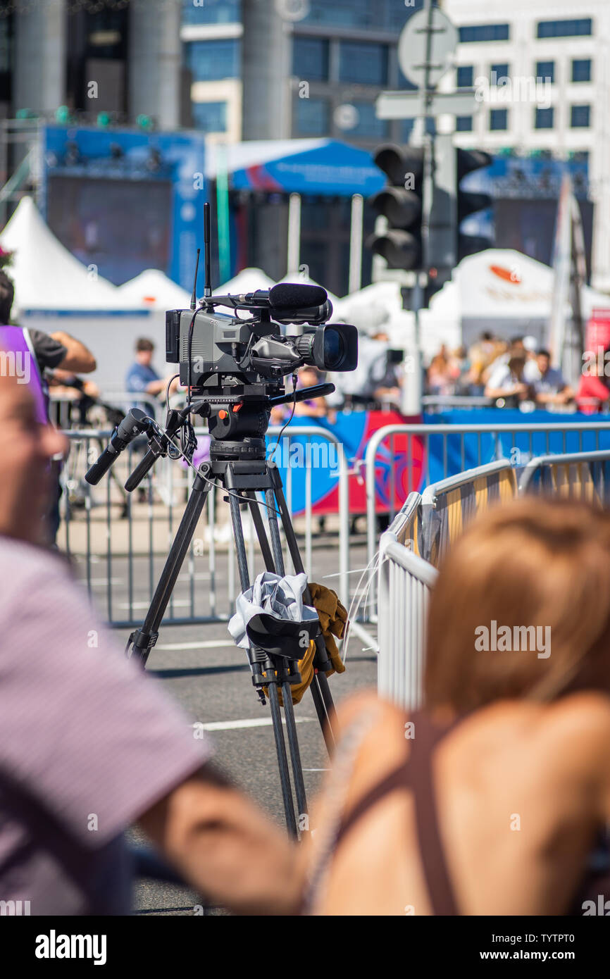 TV Camera Operator at the live event. Television. Telecast. Correspondent. Viewers Stock Photo