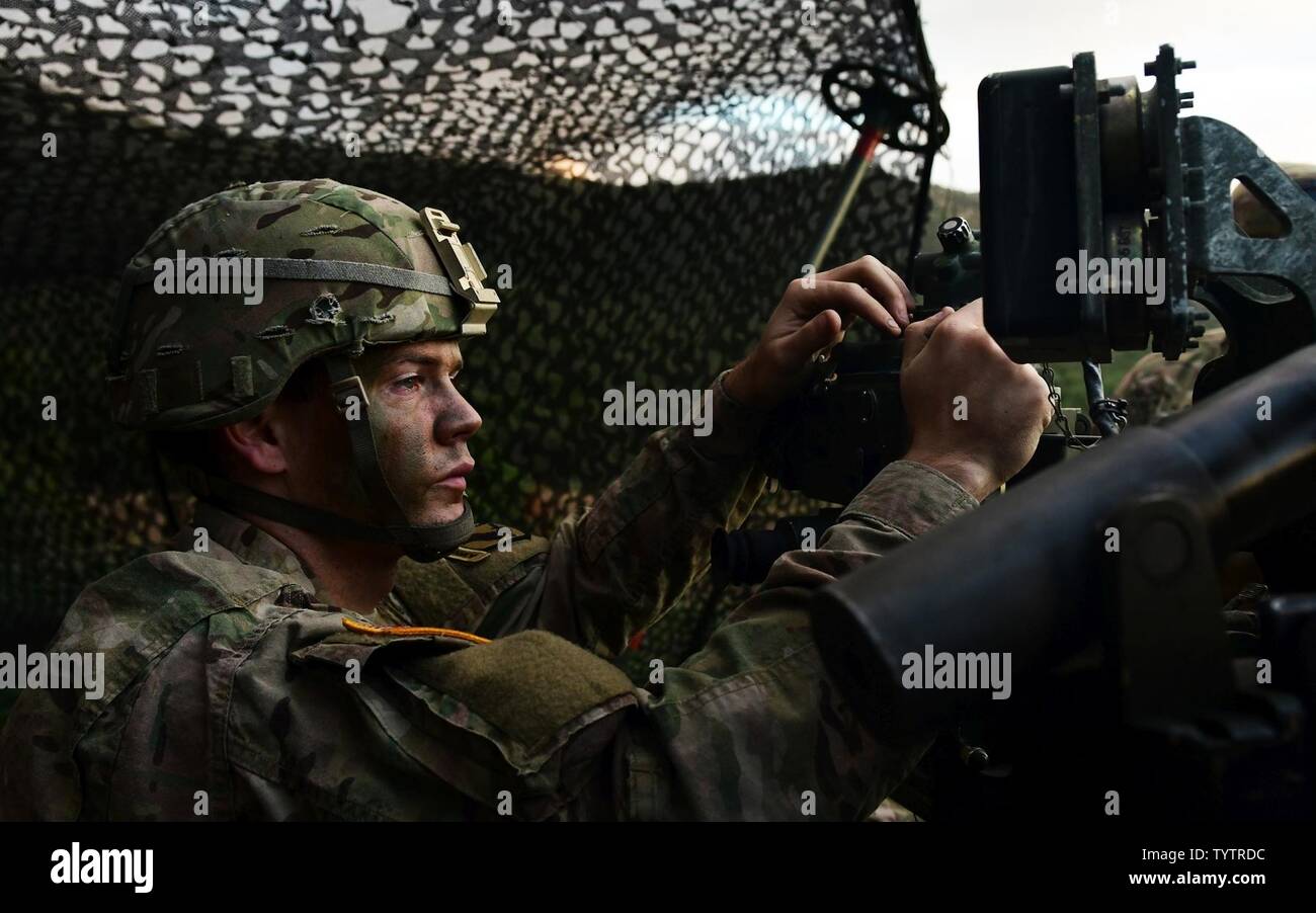 U.S. Army Spc. Stephen Sevigny, a gunner assigned to Battery A, 4th ...