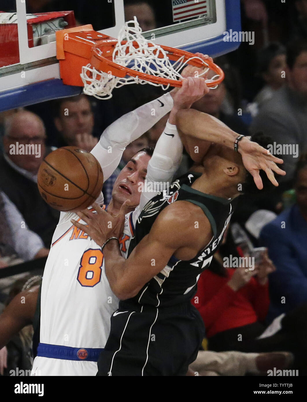 New York Knicks Mario Hezonja dunks the ball over Milwaukee Bucks Giannis  Antetokounmpo in the first quarter at Madison Square Garden in New York  City on December 1, 2018. The Knicks defeated