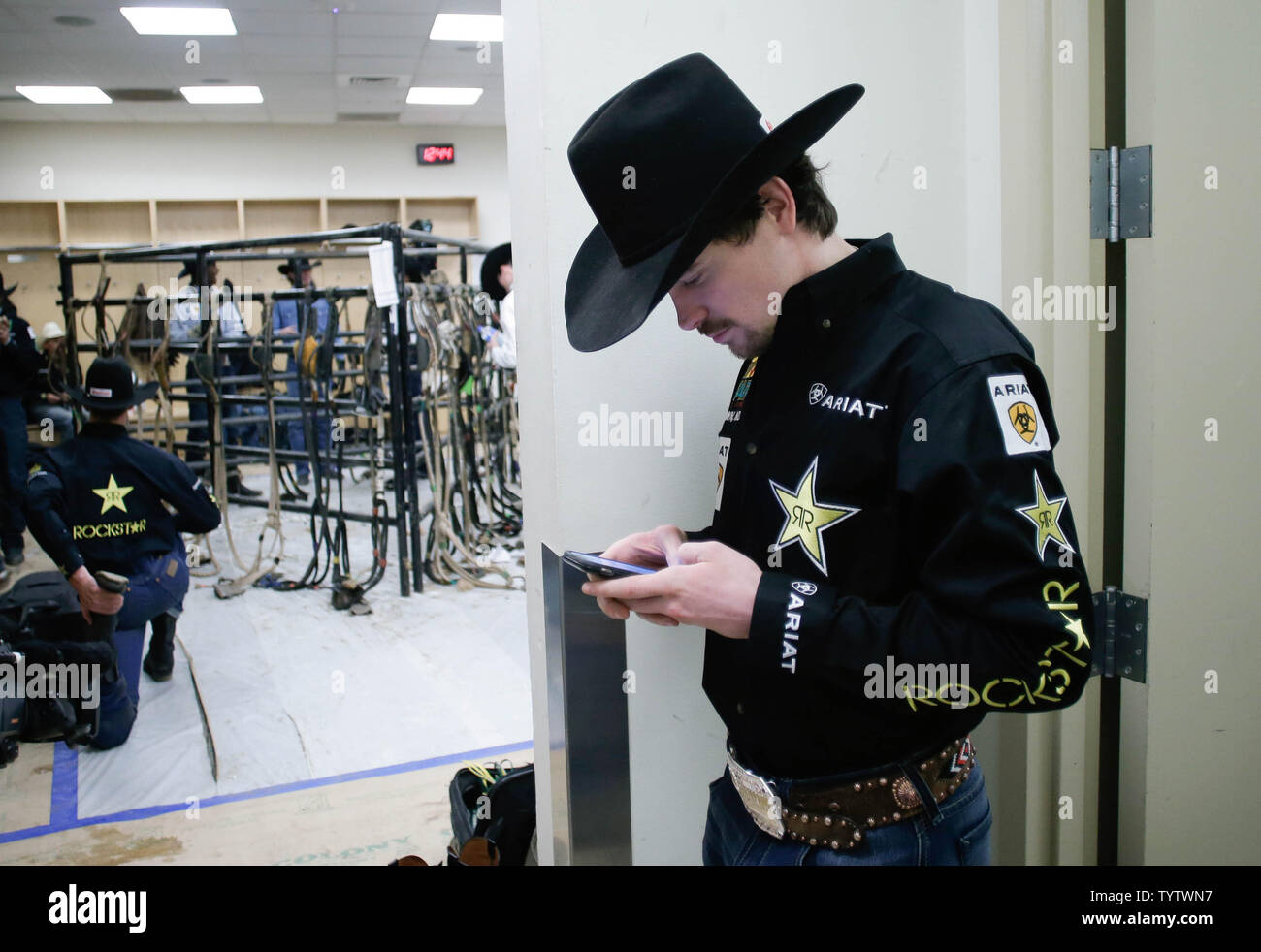 Competing bull riders get ready in the locker room at the Professional ...