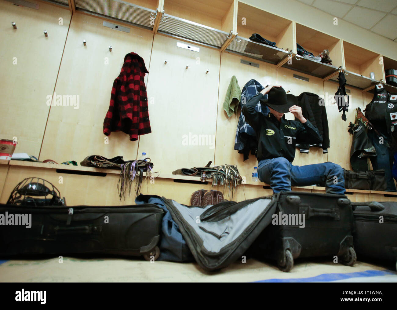 Competing Bull Riders Get Ready In The Locker Room At The