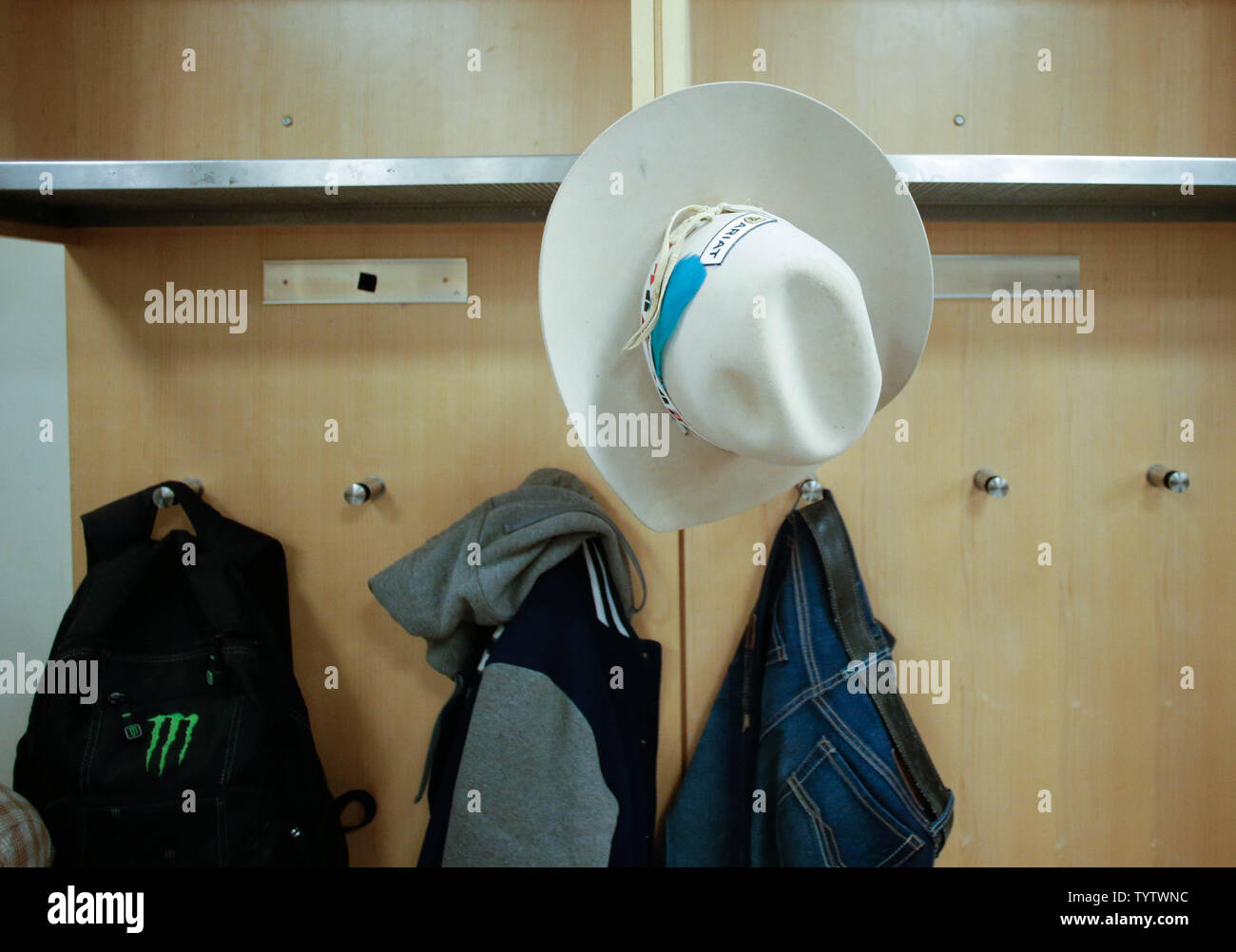 Competing Bull Riders Get Ready In The Locker Room At The