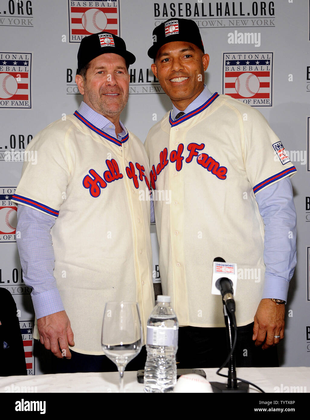 Mike Mussina and Mariano Rivera put on their Hall of Fame uniform