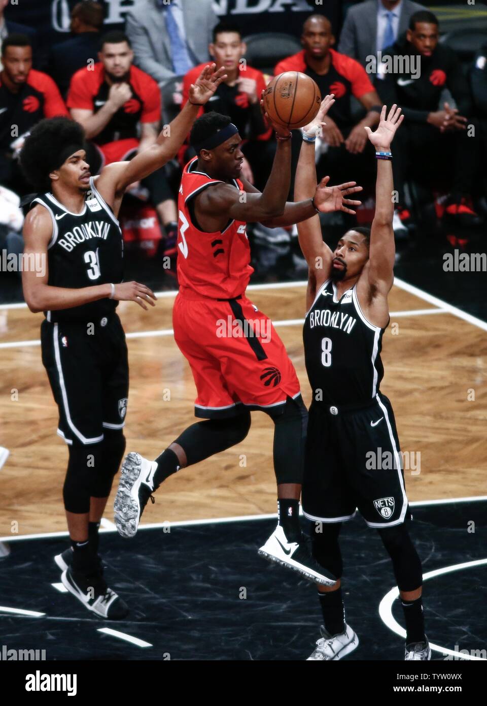 Toronto Raptors forward OG Anunoby (3) passes the ball against Brooklyn Nets center Jarrett Allen (31) and guard Spencer Dinwiddie (8) in the first half at Barclays Center in New York City on April 3, 2019.       Photo by Nicole Sweet/UPI Stock Photo