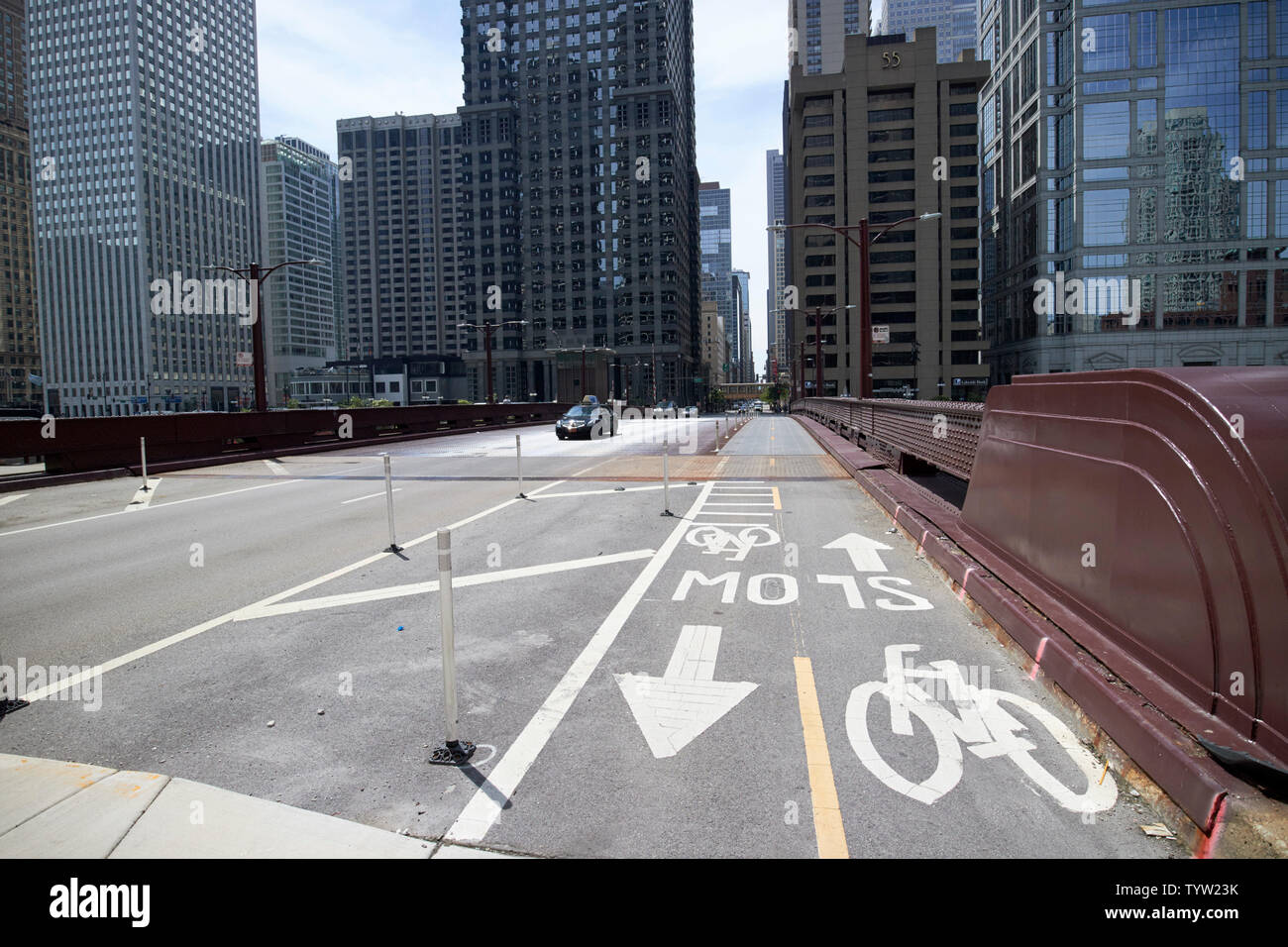 cycle lanes crossing over bridge into the downtown loop district of the city of Chicago IL USA Stock Photo