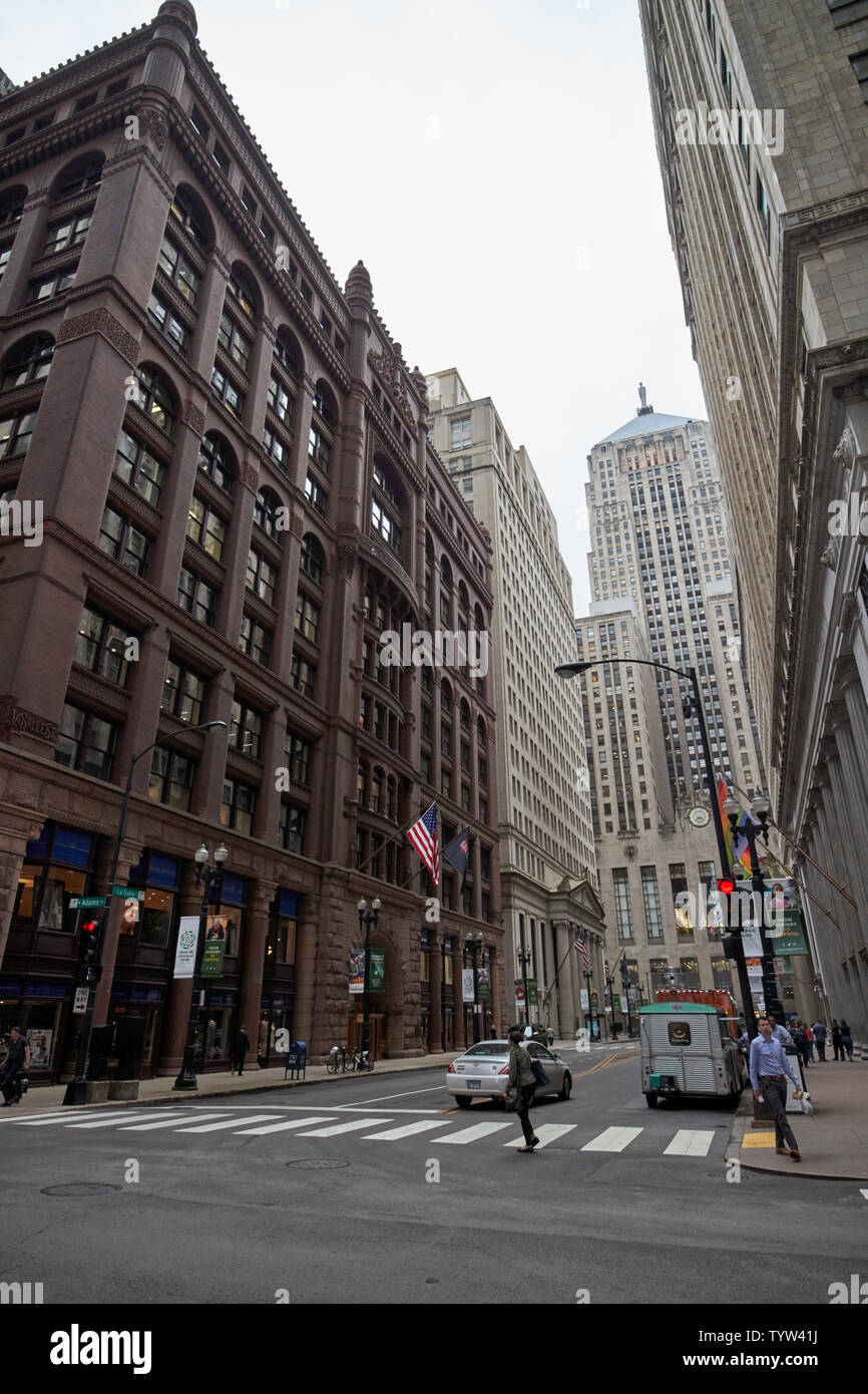 looking down the lasalle street canyon at the chicago board of trade building on a dark overcast day in the financial district of the loop Chicago IL Stock Photo