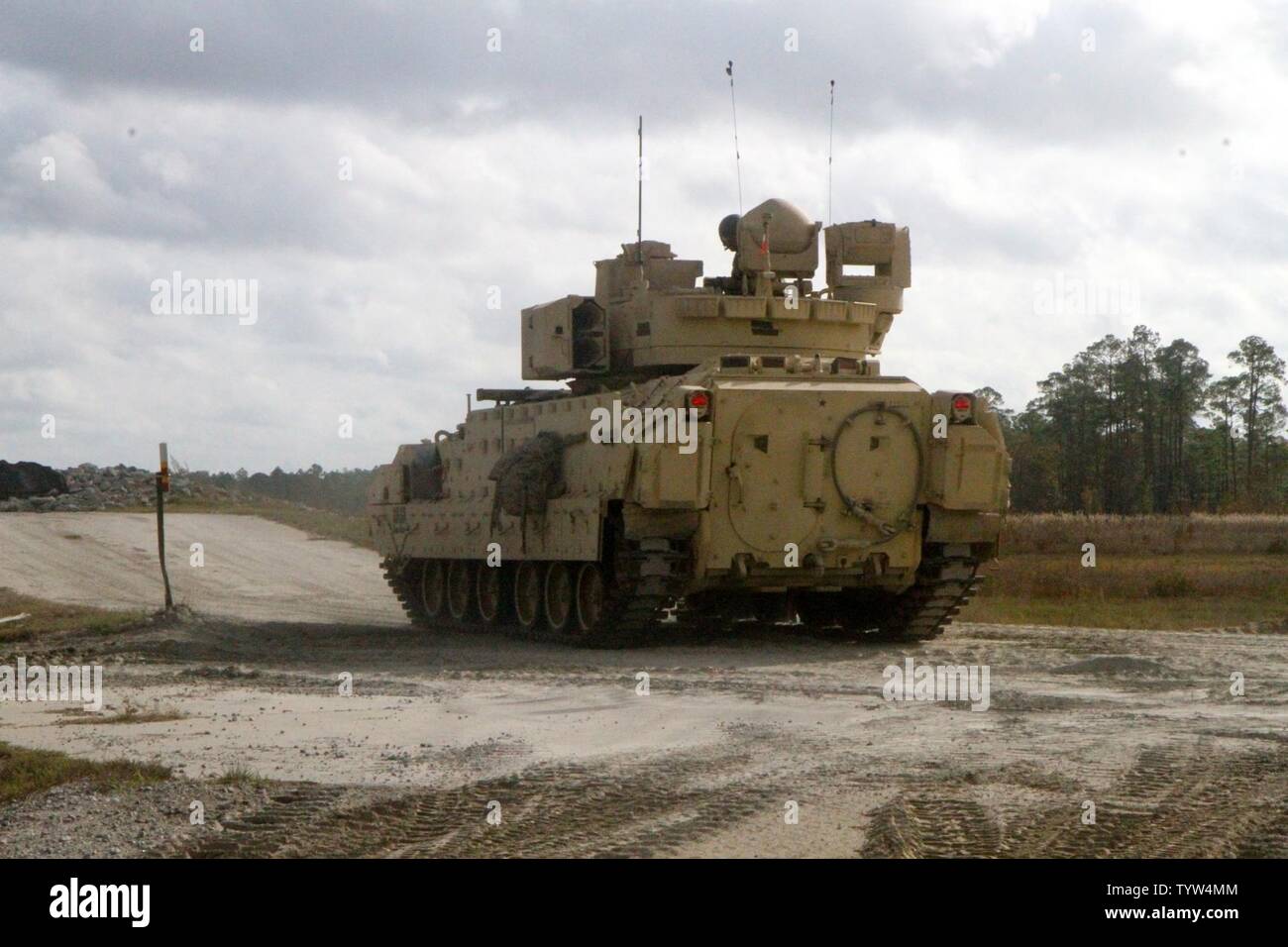 A M2A3 Bradley Fighting Vehicle from 3rd Battalion, 69th Armor Regiment, 1st Armored Brigade Combat Team, 3rd Infantry Division gets set in their position and prepares for their Gunnery Table V day run at Fort Stewart, Georgia Nov. 30, 2016. The Soldiers are preparing for the National Training Center this spring at Fort Irwin, California. Stock Photo