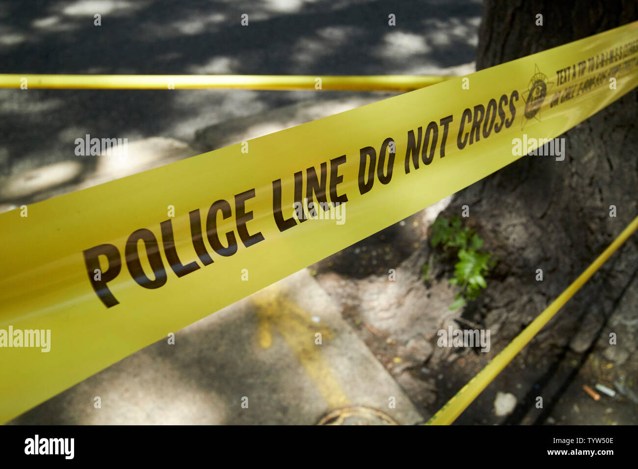 Police Line do not cross yellow incident tape chicago police department Chicago IL USA Stock Photo