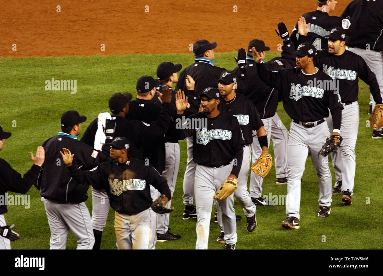 The Florida Marlins celebrate their 3-2 win over the New York Yankees in Game 1 of the World Series at Yankee Stadium on October 18, 2003.   (UPI/Roger L. Wollenberg) Stock Photo