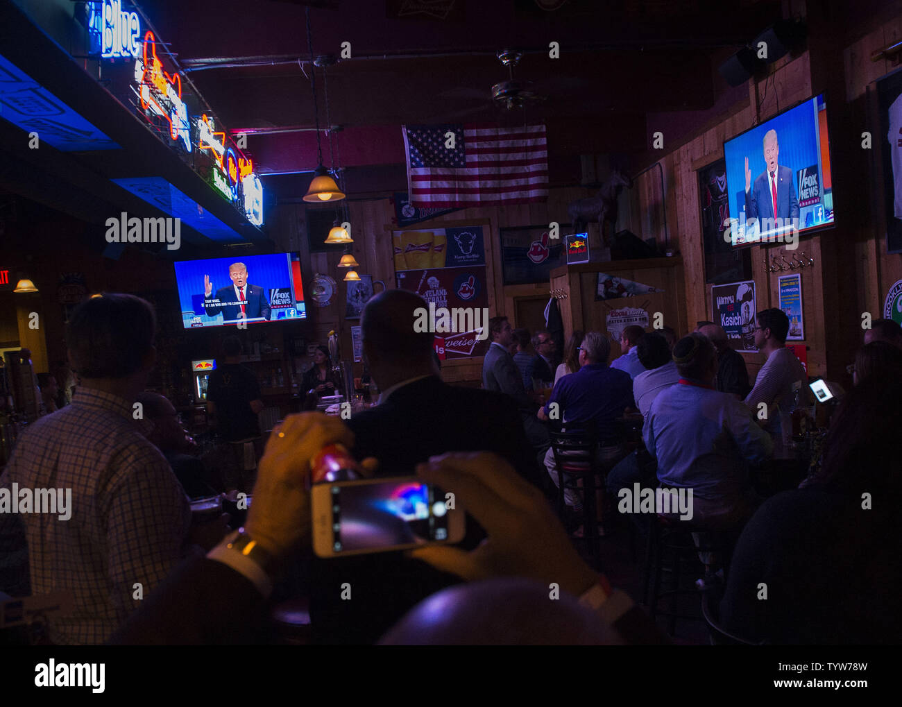 People attend a watch party for the Republican presidential debate at the Harry Buffalo bar in Cleveland, Ohio on August 6, 2015. The top ten candidates, Donald Trump, Jeb Bush, Scott Walker, Mike Huckabee, Ben Carson, Ted Cruz, Marco Rubio, Rand Paul, Chris Christie and John Kasich met in the first prime time debate for the 2016 presidential election while the six other major declared candidates, Rick Santorum, Bobby Jindal, Carly Fiorina, Lindsey Graham, George Pataki, and Jim Gilmore, participated in an earlier debate.  Photo by Kevin Dietsch/UPI Stock Photo