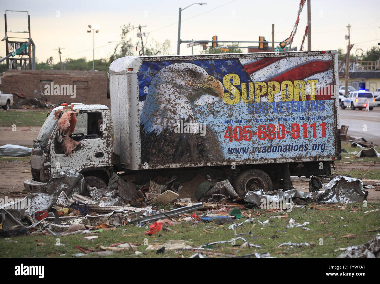 A path of destruction is seen in the aftermath of a series of tornadoes ...