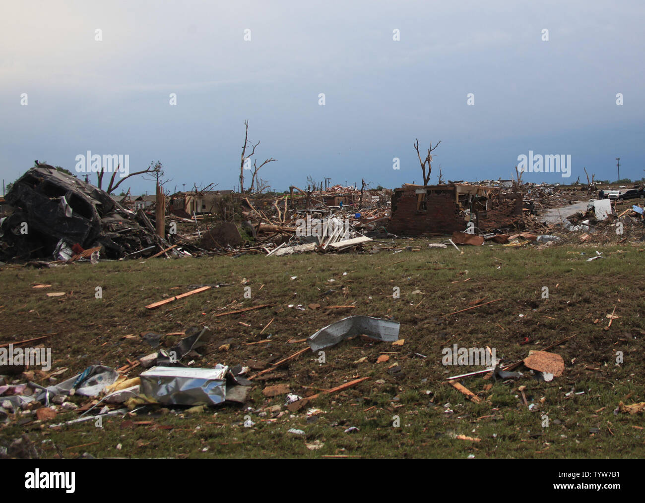 A path of destruction is seen in the aftermath of a series of tornadoes ...