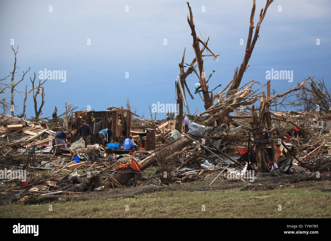 A path of destruction is seen in the aftermath of a series of tornadoes ...