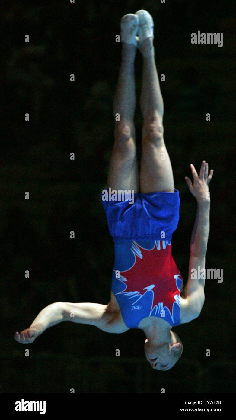 Canadian Olympic gold medal-winning gymnast Kyle Shewfelt performs an encore of his floor exercise routine in the gymnastics gala at the Athens Olympic Indoor Hall on August 24, 2004.  The Canadian gymnastics federation has filed a protest against the judging of the second vault  Shewfelt's rival Marian Dragulescu of Romania.  Three of the judges did not take the requisite 0.5 deduction for the fall on Dragulescu's landing, resulting in the Romanian receiving a bronze medal and edging out Shewfelt and his two clean vaults by 0.013 points.  (UPI Photo / Grace Chiu) Stock Photo