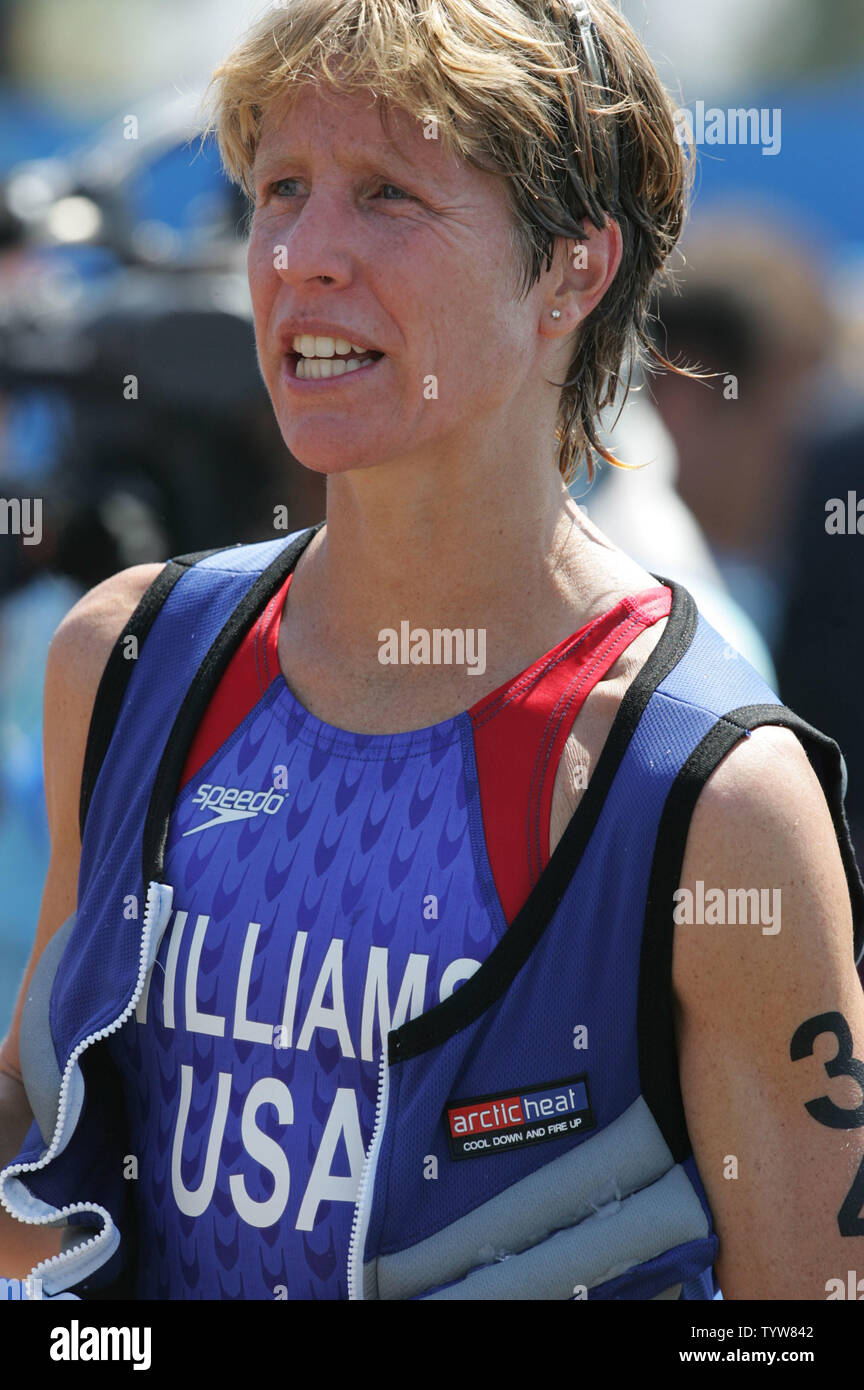 American triathlete Susan Williams dons an Artic Heat body cooling vest  after crossing the finish line of the Olympic women's triathlon in third  place at the Vouliagmeni Olympic Centre on August 25,