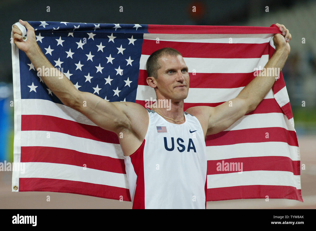 USA's Tim Mack takes a victory lap following his Olympic pole vault  achievement of 5.95 meters. (UPI Photo / Claus Andersen Stock Photo - Alamy