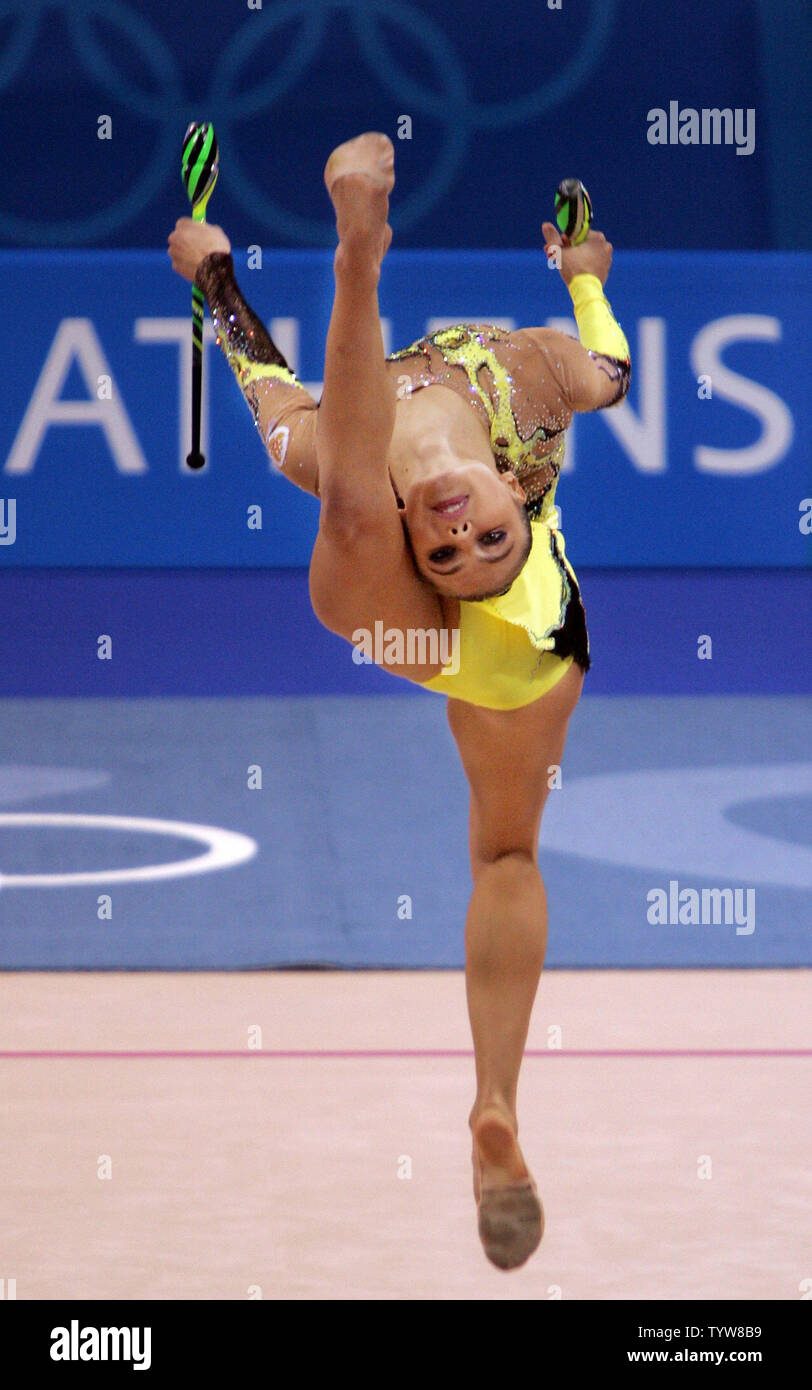 Russia's Alina Kabaeva performs her clubs routine in the rhythmic gymnastics individual all around final at the Athens Galatsi Hall on August 29, 2004. Kabaeva finished the four-apparatus event with a total of 108.400 points to win the gold medal.  (UPI Photo/Grace Chiu) Stock Photo