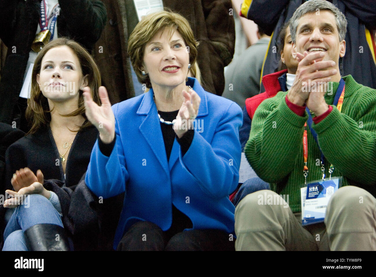 Laura Bush the wife of the President of the USA, with Eric Heiden (R), attends the men's 5000m speed skating at Oval Lingotto during the 2006 Torino Winter Olympic Games, February 11, 2006.  Chad Hedrick of the USA won gold.  (UPI Photo/Heinz Ruckemann) Stock Photo