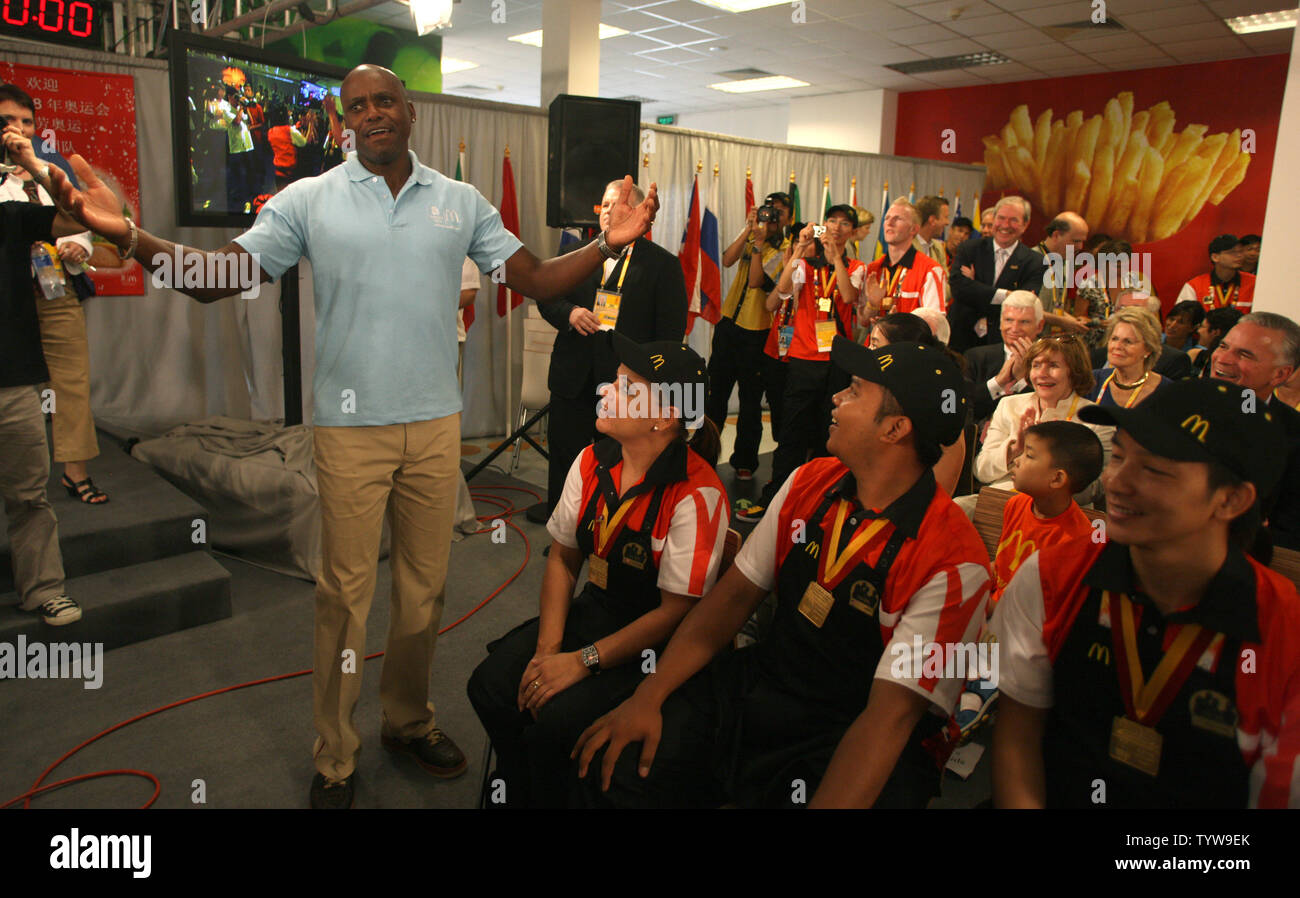 Carl Lewis (L), winner of 9 Olympic gold medals, coaches a team in a Big Mac building competition of employees from around the world, at a new McDonald's on the Olympic Green in Beijing on August 7, 2008.  McDonald's is the official restaurant of the Olympic Games.  (UPI Photo/Terry Schmitt) Stock Photo