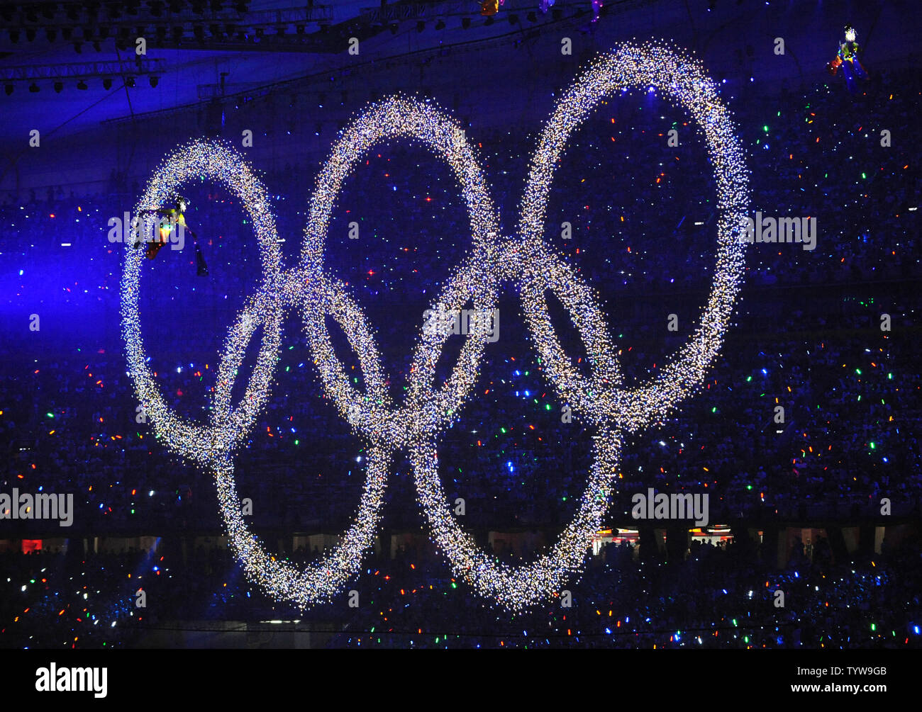 Performers fly by the Olympic Rings during the Opening Ceremony of the 2008 Summer Olympics at the National Stadium, called the Bird's Nest, in Beijing on August 8, 2008.  The Summer Games will run through August 24, 2008.   (UPI Photo/Pat Benic) Stock Photo