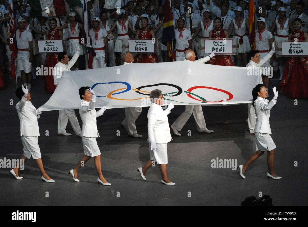 The Olympic Flag is carried into National Stadium, called the Bird's Nest, during the Opening Ceremony of the 2008 Summer Olympics in Beijing on August 8, 2008.   The Summer Games will run through August 24, 2008.   (UPI Photo/Pat Benic) Stock Photo
