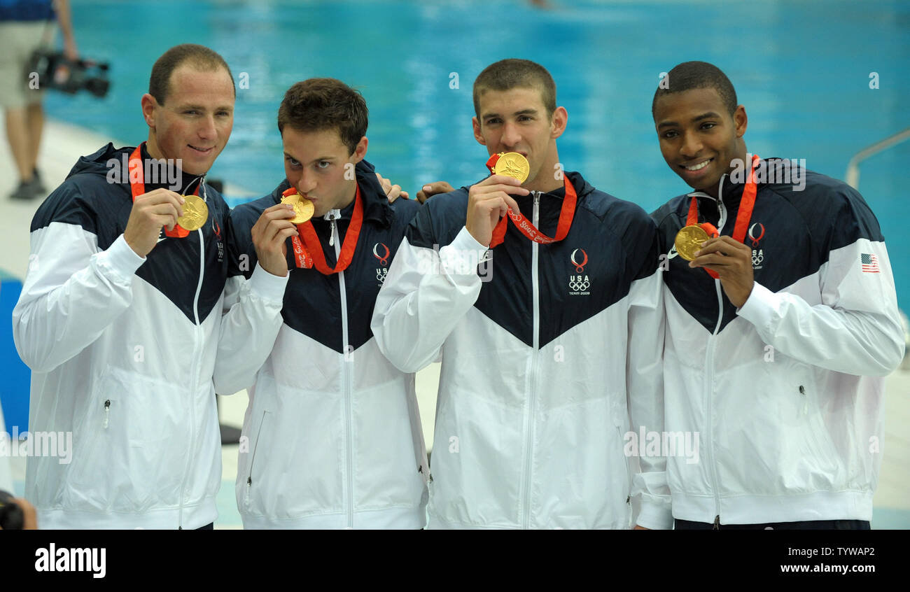 The USA's Jason Lezak, Garrett Weber-Gale, Michael Phelps and Cullens Jones (L to R) stand with their gold medal for the Men's 4x100 Meter Freestyle Relay at the National Aquatic Center (Water Cube) during the 2008 Summer Olympics in Beijing, China, on August 11, 2008.   (UPI Photo/Roger L. Wollenberg) Stock Photo