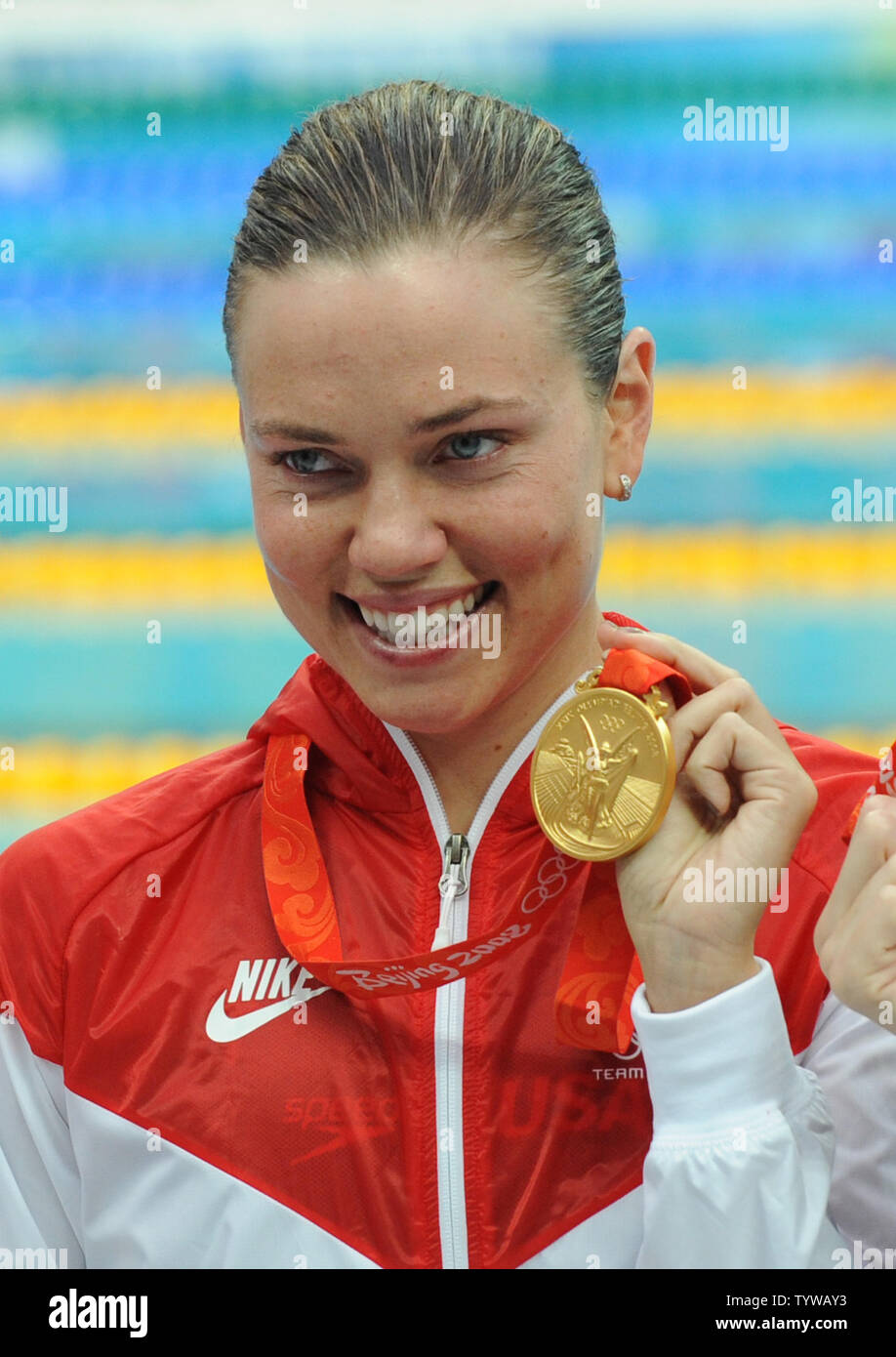 USA's gold medal winner Natalie Coughlin shows her medal after the awards ceremony for the Women's 100M Backstroke at the National Aquatics Center at the Summer Olympics in Beijing on August 12, 2008.  Coughlin's time was 58.96.   (UPI Photo/Pat Benic) Stock Photo