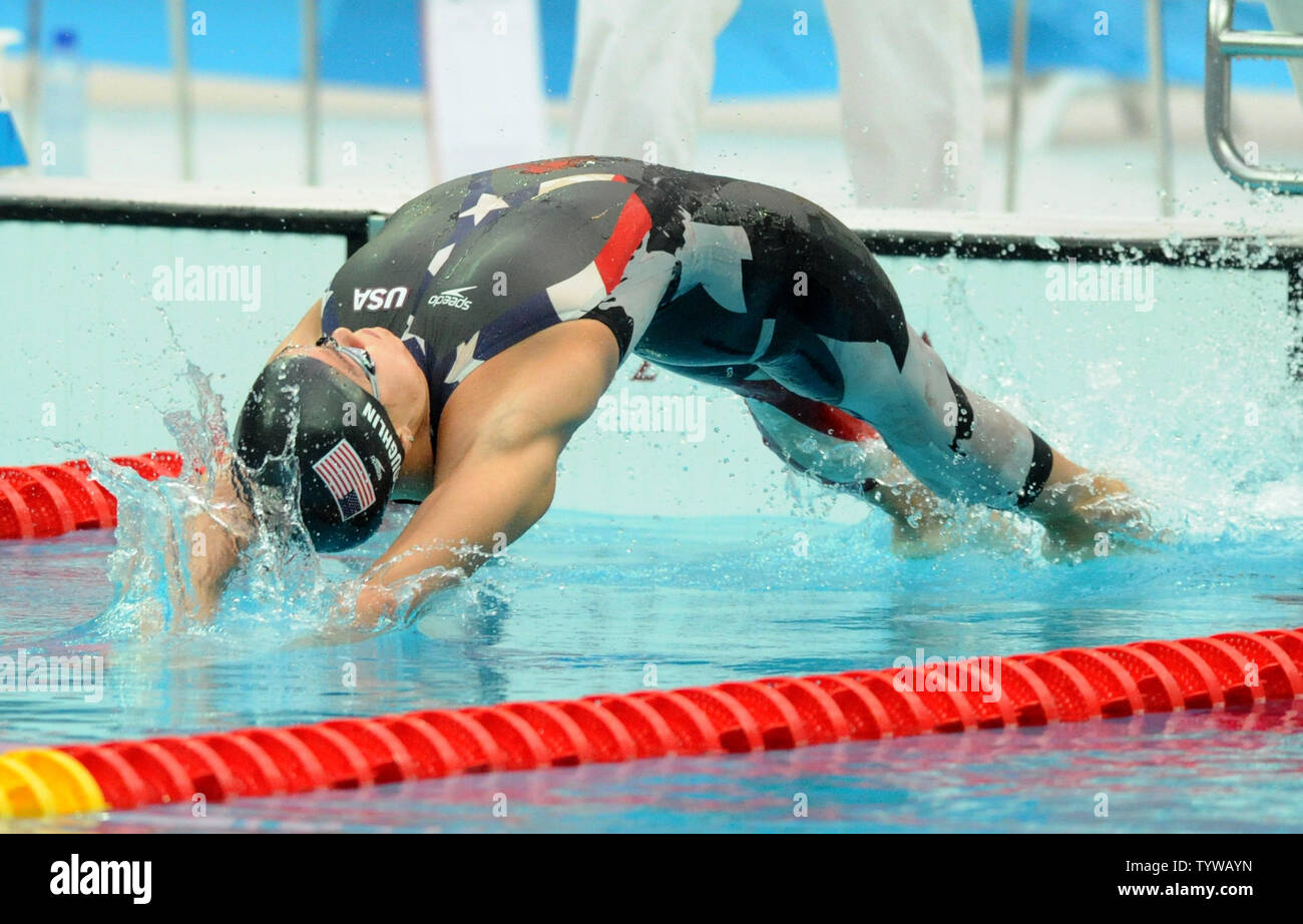 USA's Natalie Coughlin leaps into the water at the start of the Women's 100M Backstroke at the National Aquatics Center at the Summer Olympics in Beijing on August 12, 2008.  Coughlin's won the gold medal with a time of 58.96.   (UPI Photo/Pat Benic) Stock Photo