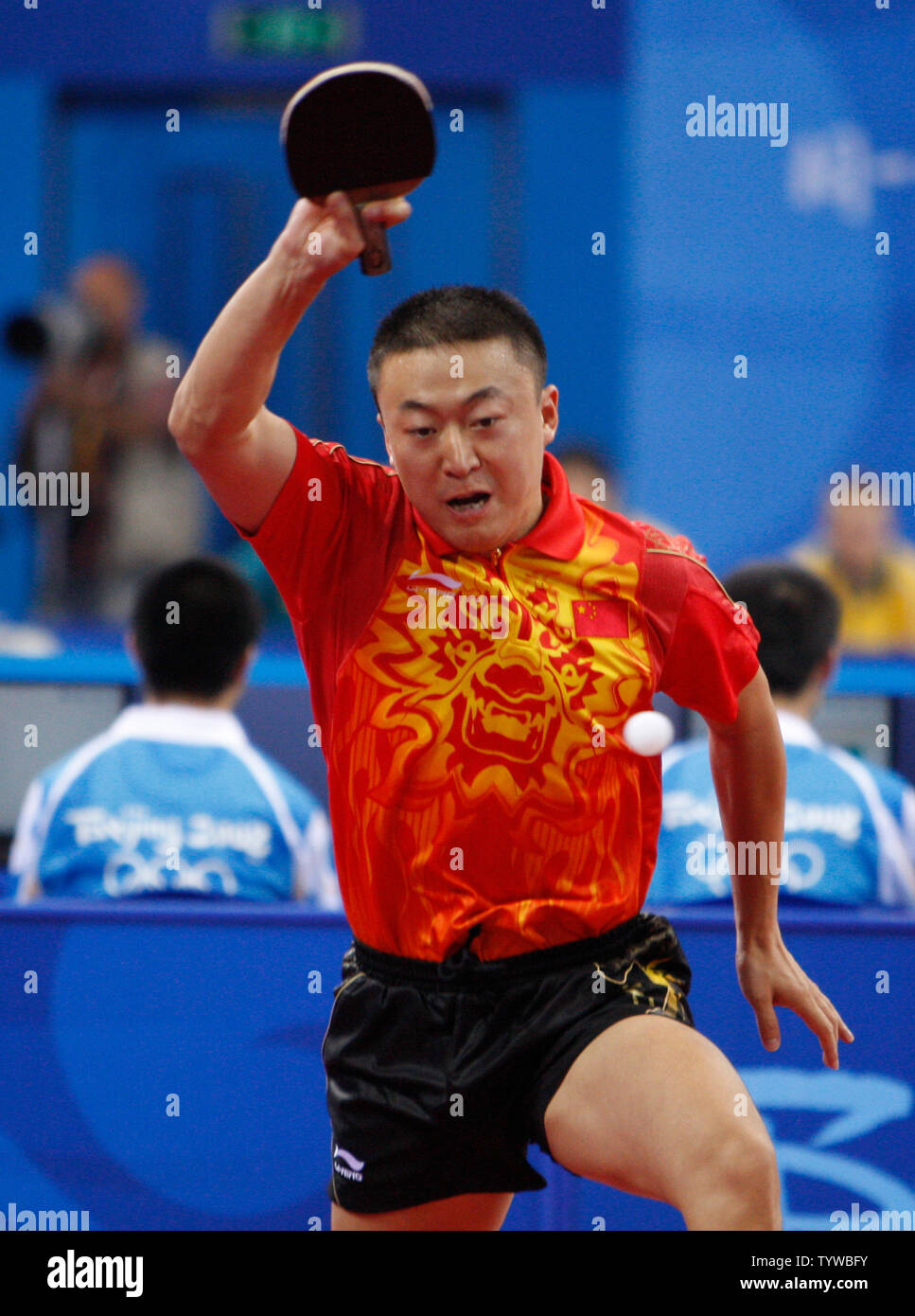Ma Lin of China volleys with Panagiotis Gionis of Greece in the first round of Table Tennis eliminations in Beijing on August 13, 2008. Lin defeated Gionis.  (UPI Photo/Terry Schmitt) Stock Photo