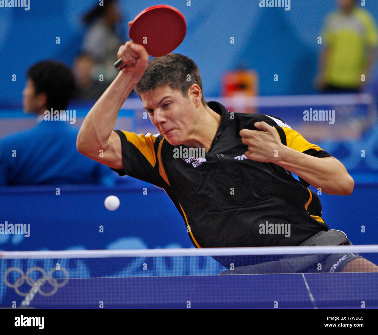 Dimitri Ovtcharov of Germany volleys with Tan Ruiwu of Croatia in the first round of Table Tennis eliminations in Beijing on August 13, 2008.   (UPI Photo/Terry Schmitt) Stock Photo