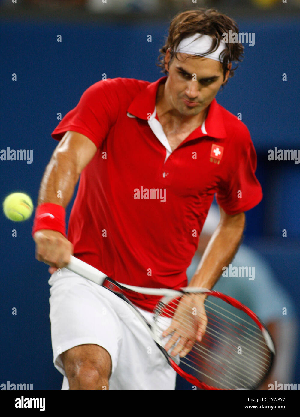 Roger Federer of Switzerland returns a volley to James Blake of the United  States in the quarterfinals of men's tennis at the 2008 Olympics in Beijing  on August 14, 2008. Blake upset