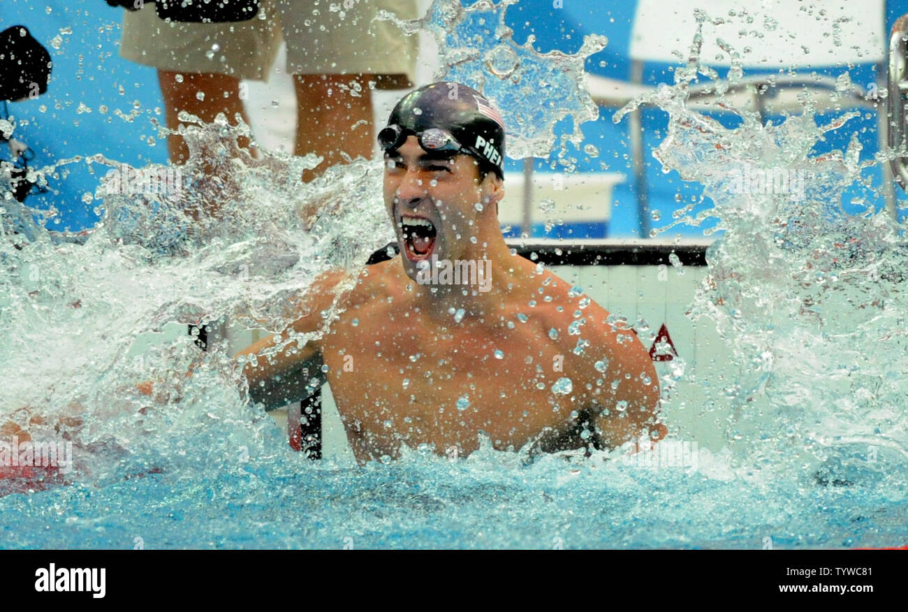 USA's Michael Phelps splashes the water in jubilation as he wins the gold in the Men's 100 meter Butterfly final at the National Aquatics Center at the Summer Olympics in Beijing on August 16, 2008.  Phelps won his seventh gold medal of the games setting another world record of 50.58 seconds. Serbian Milorad Cavic finished 0.01 second behind with a time fo 50.59 seconds.   (UPI Photo/Pat Benic) Stock Photo