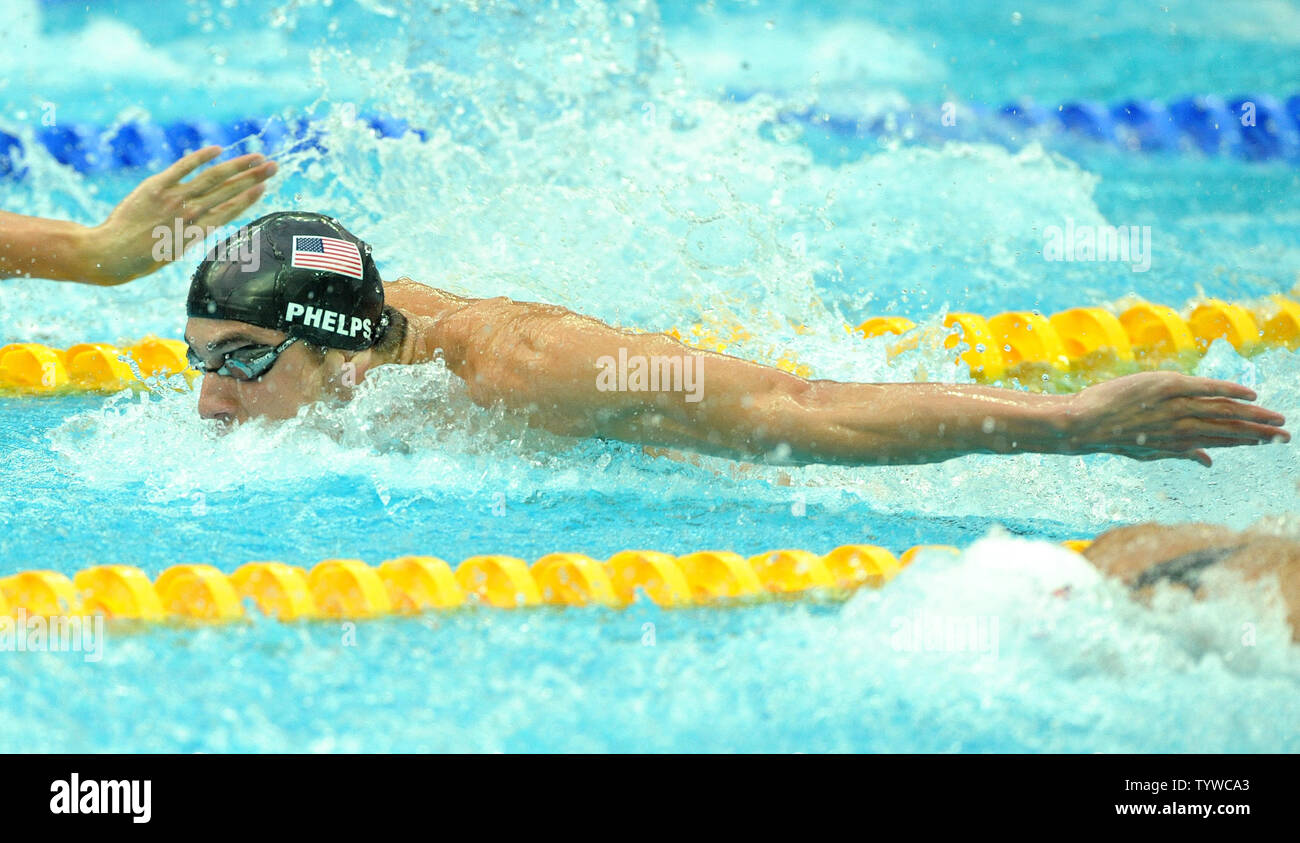 USA's Michael Phelps picks up his 7th gold medal in the Men's 100M Butterfly final at the National Aquatic Center (Water Cube) during the 2008 Summer Olympics in Beijing, China, on August 16, 2008. Phelps is tied with Mark Spitz, the swimmer who set the record for 7 gold medals in a single Olympics in Munich, 1972.  (UPI Photo/Roger L. Wollenberg) Stock Photo