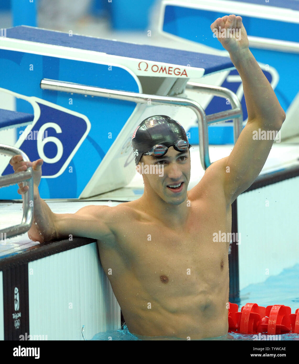 USA's Michael Phelps celebrates after racing for his 7th gold medal in the Men's 100M Butterfly final at the National Aquatic Center (Water Cube) during the 2008 Summer Olympics in Beijing, China, on August 16, 2008. Phelps is tied with Mark Spitz, the swimmer who set the record for 7 gold medals in a single Olympics in Munich, 1972.  (UPI Photo/Roger L. Wollenberg) Stock Photo