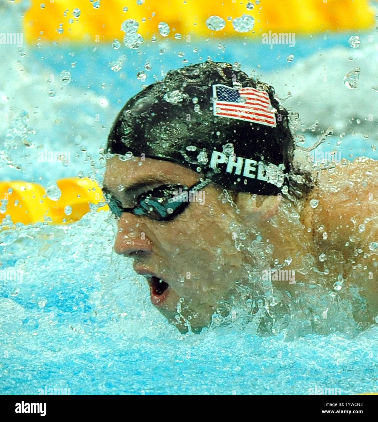 USA's Michael Phelps picks up his eighth gold medal as he swims the Butterfly part of the Men's 4x100M, helping the US team set a world record and win gold, at the National Aquatic Center (Water Cube) during the 2008 Summer Olympics in Beijing, China, on August 17, 2008.  Phelps set the world record for medals in a single Olympics with 8, passing Mark Spitz.    (UPI Photo/Roger L. Wollenberg) Stock Photo