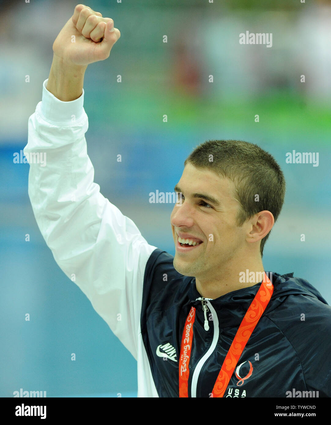 USA's Michael Phelps walks with his medal for his part in the Men's 4x100M Medley, where the US team set a world record and won gold, at the National Aquatic Center (Water Cube) during the 2008 Summer Olympics in Beijing, China, on August 17, 2008.  Phelps set the world record for medals in a single Olympics with 8, passing Mark Spitz.    (UPI Photo/Roger L. Wollenberg) Stock Photo
