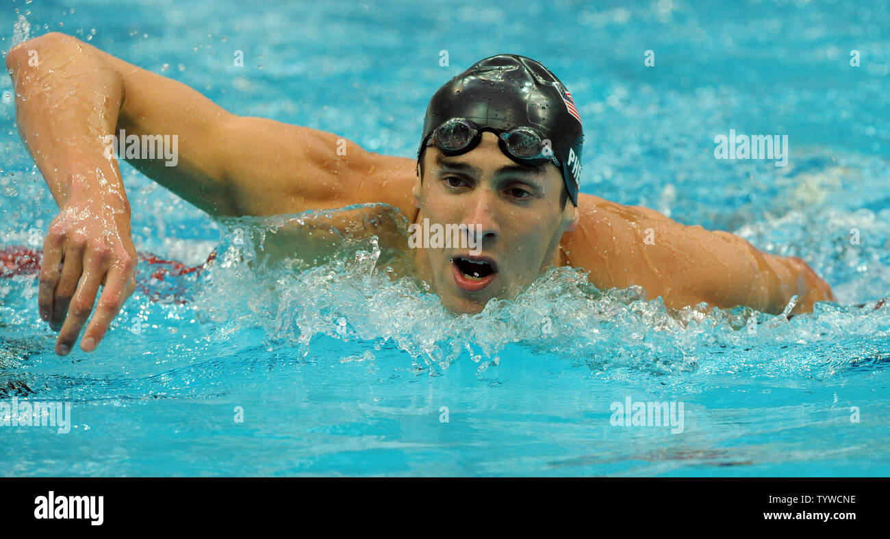 USA's Michael Phelps struggles out of the water after swimming the Butterfly part of the Men's 4x100M, helping the US team set a world record and win gold, at the National Aquatic Center (Water Cube) during the 2008 Summer Olympics in Beijing, China, on August 17, 2008.  Phelps set the world record for medals in a single Olympics with 8, passing Mark Spitz.    (UPI Photo/Roger L. Wollenberg) Stock Photo