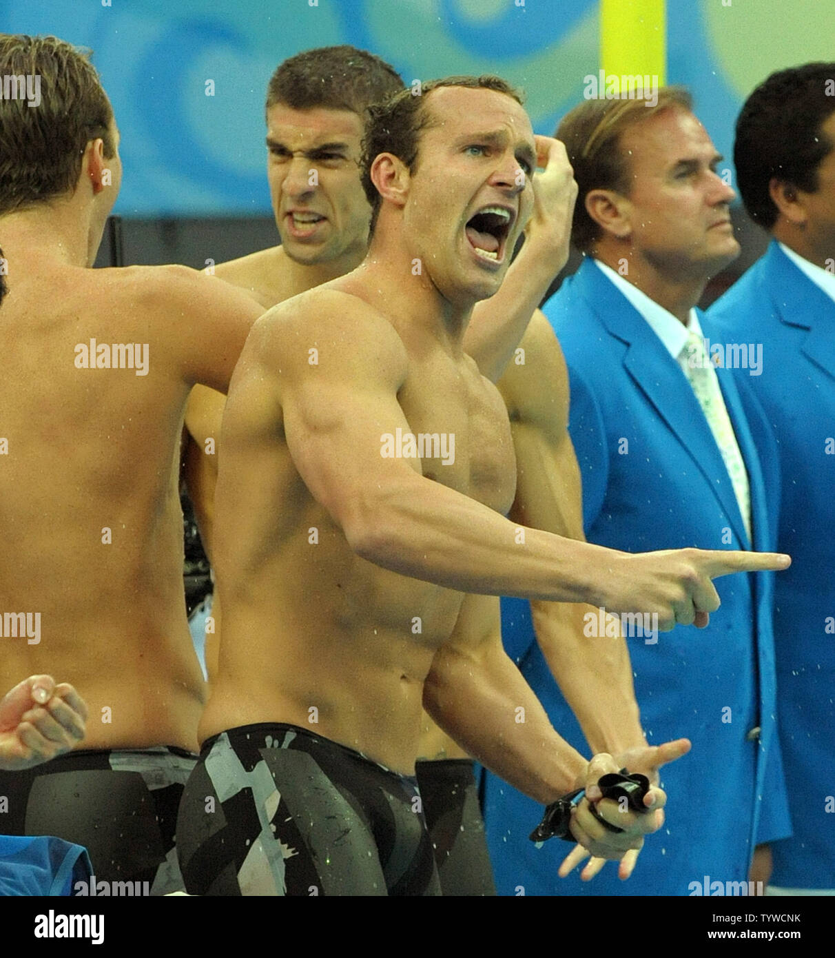 USA's Brendan Hansen cheers as team mates Michael Phelps and Aaron Peirsol embrace as the US team wins the Men's 4x100M Medley, setting a world record of 3:29.34, at the National Aquatic Center (Water Cube) during the 2008 Summer Olympics in Beijing, China, on August 17, 2008.  Phelps set the world record for medals in a single Olympics with 8, passing Mark Spitz.    (UPI Photo/Roger L. Wollenberg) Stock Photo