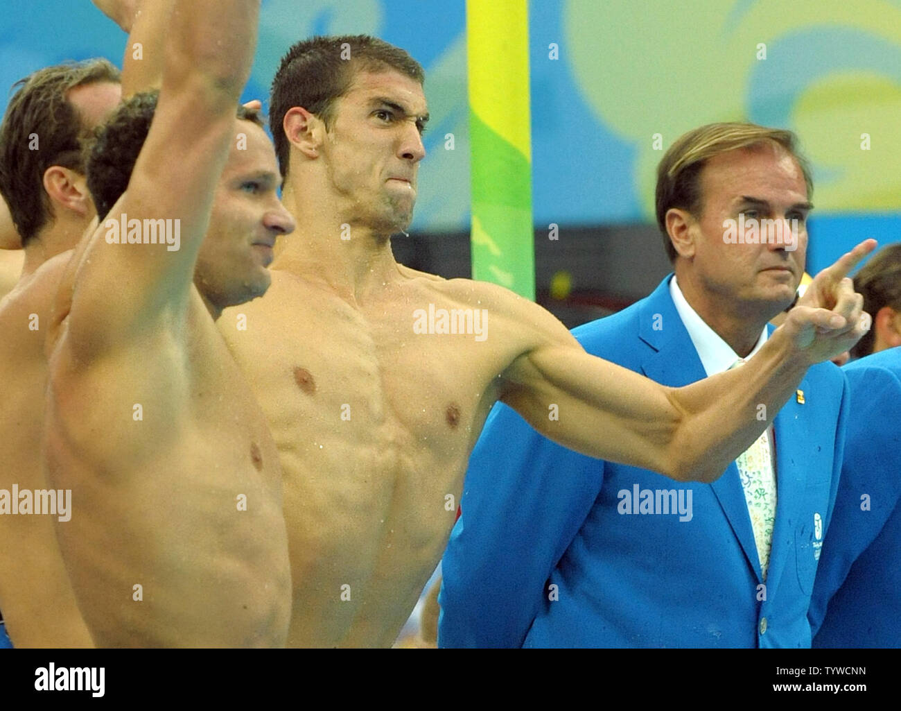 USA's Michael Phelps (R) and team mate Brendan Hansen begin to cheer as the US team wins the Men's 4x100M Medley, setting a world record of 3:29.34, at the National Aquatic Center (Water Cube) during the 2008 Summer Olympics in Beijing, China, on August 17, 2008.  Phelps set the world record for medals in a single Olympics with 8, passing Mark Spitz.    (UPI Photo/Roger L. Wollenberg) Stock Photo